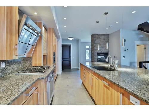 2123 Broadview Road Nw, Calgary, AB - Indoor Photo Showing Kitchen With Fireplace With Double Sink With Upgraded Kitchen