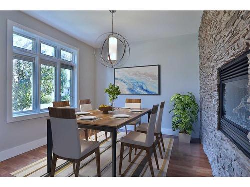 2123 Broadview Road Nw, Calgary, AB - Indoor Photo Showing Dining Room With Fireplace