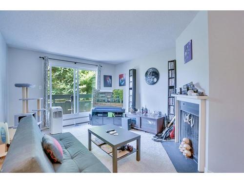 9203-315 Southampton Drive Sw, Calgary, AB - Indoor Photo Showing Living Room With Fireplace