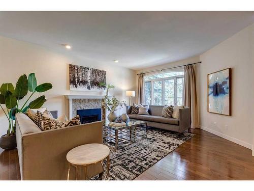 115-5555 Elbow Drive Sw, Calgary, AB - Indoor Photo Showing Living Room With Fireplace