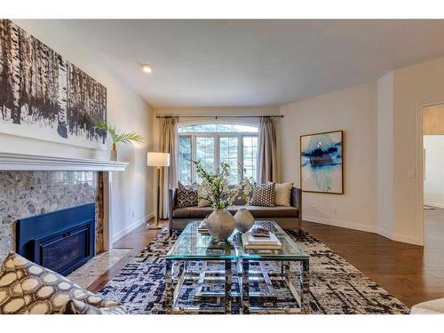 115-5555 Elbow Drive Sw, Calgary, AB - Indoor Photo Showing Living Room With Fireplace