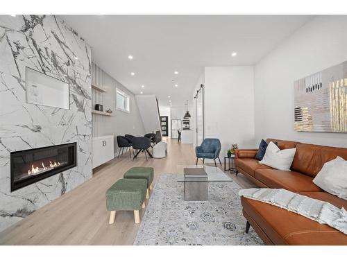 2025 26 Street Sw, Calgary, AB - Indoor Photo Showing Living Room With Fireplace