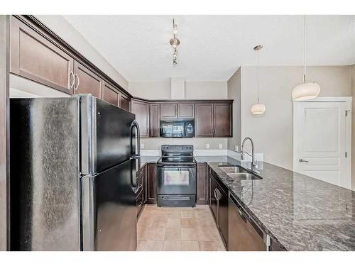 1013 Evanston Square Nw, Calgary, AB - Indoor Photo Showing Kitchen With Double Sink