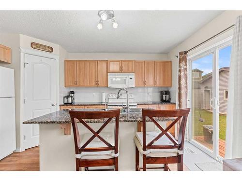 268 Panatella Drive Nw, Calgary, AB - Indoor Photo Showing Kitchen With Double Sink