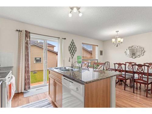 268 Panatella Drive Nw, Calgary, AB - Indoor Photo Showing Kitchen With Double Sink