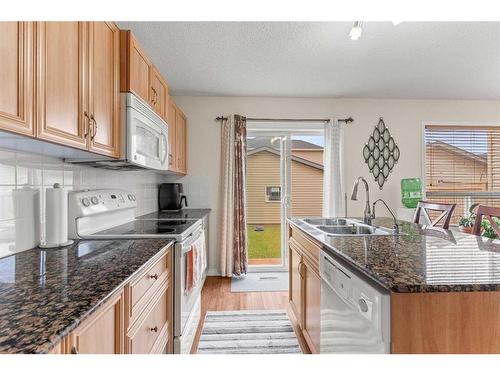 268 Panatella Drive Nw, Calgary, AB - Indoor Photo Showing Kitchen With Double Sink