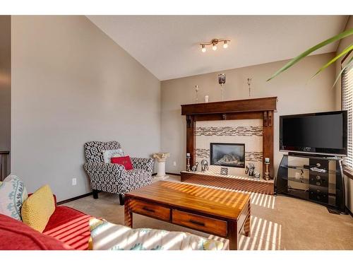 33 Evansview Manor Nw, Calgary, AB - Indoor Photo Showing Living Room With Fireplace