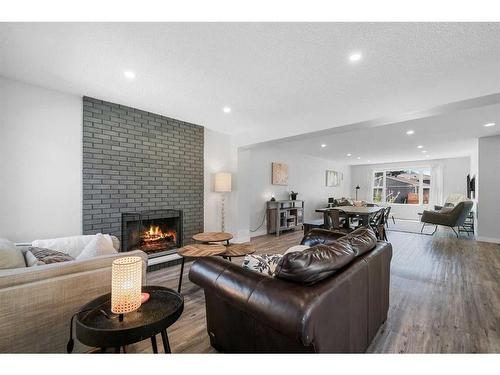 108 Cantrell Drive Sw, Calgary, AB - Indoor Photo Showing Living Room With Fireplace