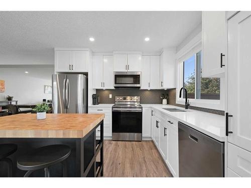 108 Cantrell Drive Sw, Calgary, AB - Indoor Photo Showing Kitchen With Stainless Steel Kitchen With Upgraded Kitchen