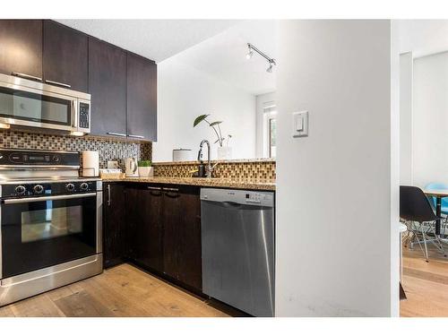 106-333 22 Avenue Sw, Calgary, AB - Indoor Photo Showing Kitchen With Stainless Steel Kitchen