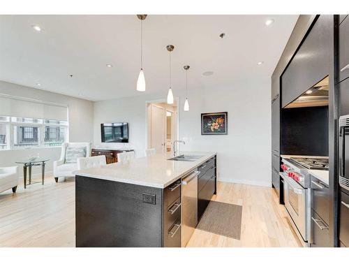 721 Aspen Meadows Hill Sw, Calgary, AB - Indoor Photo Showing Kitchen With Double Sink With Upgraded Kitchen