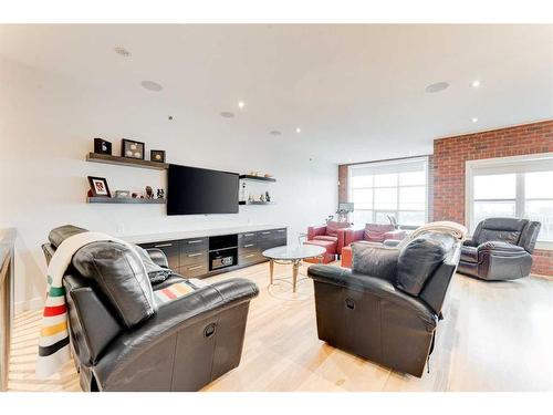 721 Aspen Meadows Hill Sw, Calgary, AB - Indoor Photo Showing Living Room With Fireplace