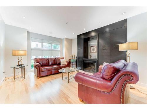 721 Aspen Meadows Hill Sw, Calgary, AB - Indoor Photo Showing Living Room With Fireplace