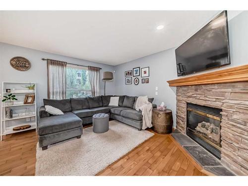 219 New Brighton Circle Se, Calgary, AB - Indoor Photo Showing Living Room With Fireplace