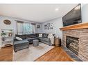 219 New Brighton Circle Se, Calgary, AB  - Indoor Photo Showing Living Room With Fireplace 