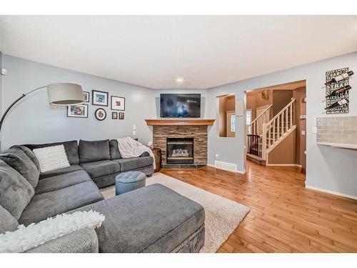 219 New Brighton Circle Se, Calgary, AB - Indoor Photo Showing Living Room With Fireplace