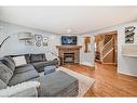 219 New Brighton Circle Se, Calgary, AB  - Indoor Photo Showing Living Room With Fireplace 