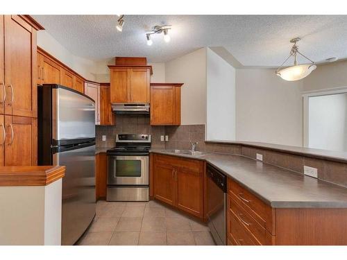 335-10 Discovery Ridge Close Sw, Calgary, AB - Indoor Photo Showing Kitchen With Stainless Steel Kitchen