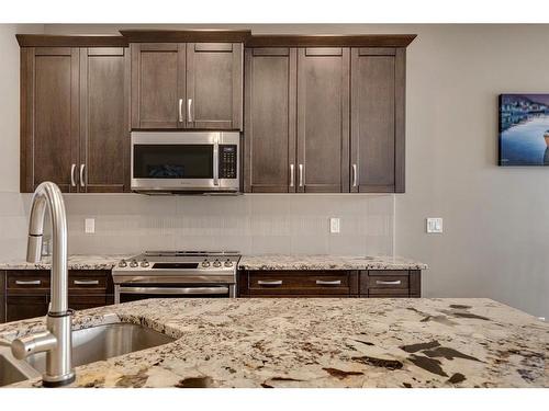 650 West Highland Crescent, Carstairs, AB - Indoor Photo Showing Kitchen With Double Sink With Upgraded Kitchen