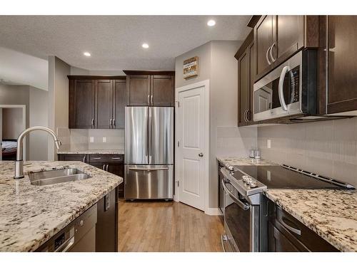 650 West Highland Crescent, Carstairs, AB - Indoor Photo Showing Kitchen With Double Sink With Upgraded Kitchen