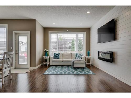 650 West Highland Crescent, Carstairs, AB - Indoor Photo Showing Living Room With Fireplace