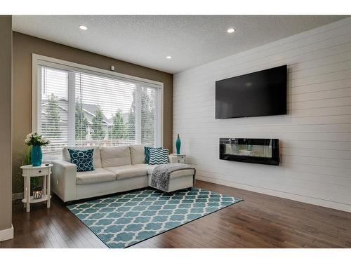 650 West Highland Crescent, Carstairs, AB - Indoor Photo Showing Living Room With Fireplace