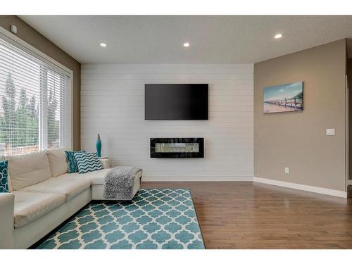 650 West Highland Crescent, Carstairs, AB - Indoor Photo Showing Living Room With Fireplace