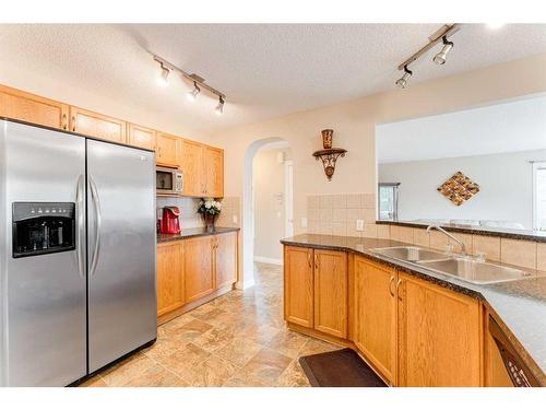 117 Springmere Grove, Chestermere, AB - Indoor Photo Showing Kitchen With Double Sink