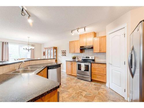 117 Springmere Grove, Chestermere, AB - Indoor Photo Showing Kitchen With Double Sink