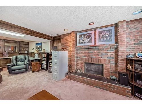 6023 Thornaby Way Nw, Calgary, AB - Indoor Photo Showing Living Room With Fireplace