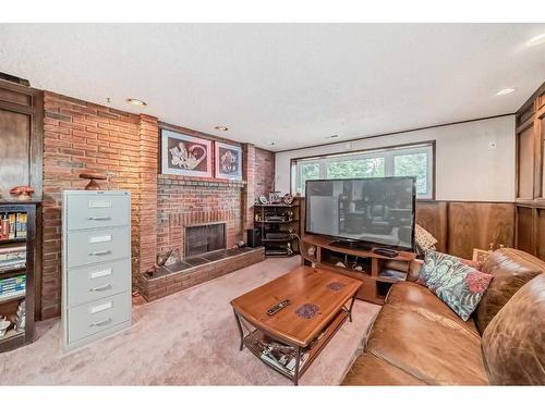 6023 Thornaby Way Nw, Calgary, AB - Indoor Photo Showing Living Room With Fireplace