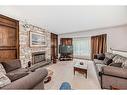 6023 Thornaby Way Nw, Calgary, AB  - Indoor Photo Showing Living Room With Fireplace 