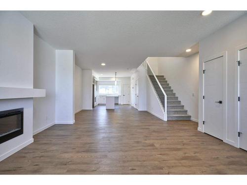 70 Legacy Reach Bay Se, Calgary, AB - Indoor Photo Showing Living Room With Fireplace