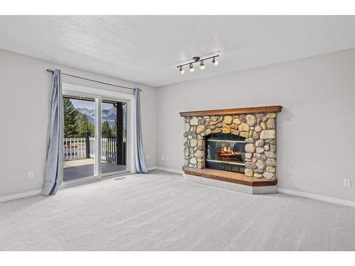 3 Ridge Road, Canmore, AB - Indoor Photo Showing Living Room With Fireplace