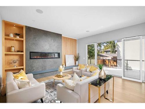 632 26 Avenue Nw, Calgary, AB - Indoor Photo Showing Living Room With Fireplace