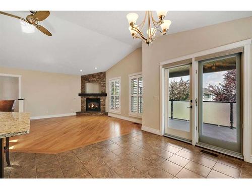 2122 High Country Rise Nw, High River, AB - Indoor Photo Showing Living Room With Fireplace