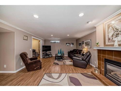 1070 Coventry Drive Ne, Calgary, AB - Indoor Photo Showing Living Room With Fireplace