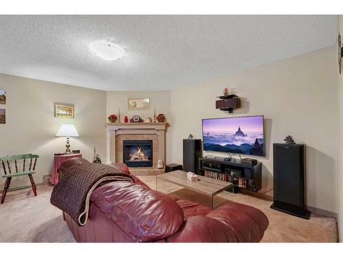 1920 Riverside Boulevard Nw, High River, AB - Indoor Photo Showing Living Room With Fireplace