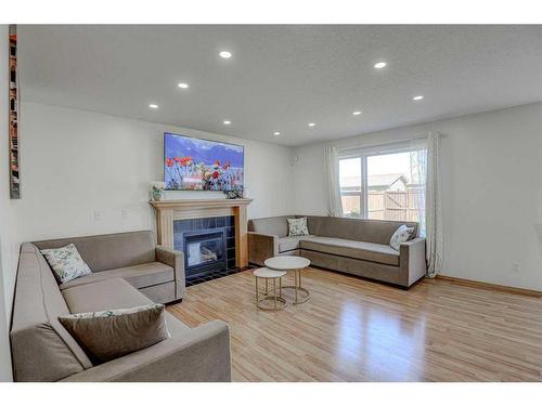 28 Tarawood Grove Ne, Calgary, AB - Indoor Photo Showing Living Room With Fireplace