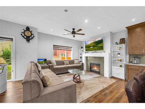 89 Saddlestone Place Ne, Calgary, AB - Indoor Photo Showing Living Room With Fireplace