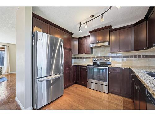 669 West Highland Crescent, Carstairs, AB - Indoor Photo Showing Kitchen With Stainless Steel Kitchen With Double Sink