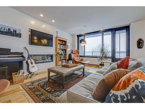 305-3204 Rideau Place Sw, Calgary, AB - Indoor Photo Showing Living Room With Fireplace