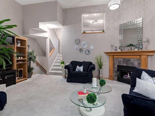 22 Lincoln Green Sw, Calgary, AB - Indoor Photo Showing Living Room With Fireplace