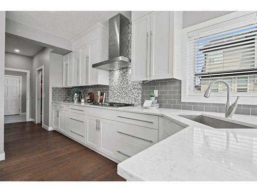 88 Rainbow Falls Blvd, Chestermere, AB - Indoor Photo Showing Kitchen With Upgraded Kitchen