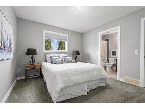 88 Rainbow Falls Blvd, Chestermere, AB - Indoor Photo Showing Bedroom