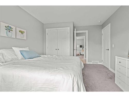 88 Rainbow Falls Blvd, Chestermere, AB - Indoor Photo Showing Bedroom