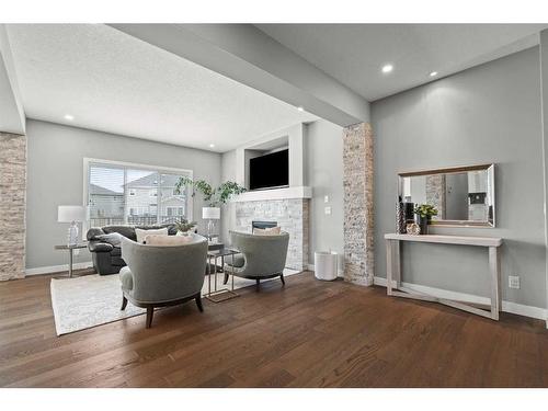 88 Rainbow Falls Blvd, Chestermere, AB - Indoor Photo Showing Other Room With Fireplace