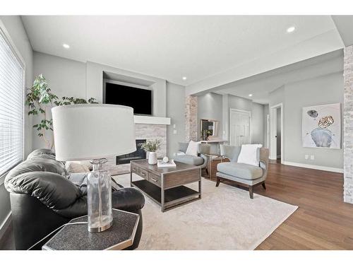 88 Rainbow Falls Blvd, Chestermere, AB - Indoor Photo Showing Living Room With Fireplace