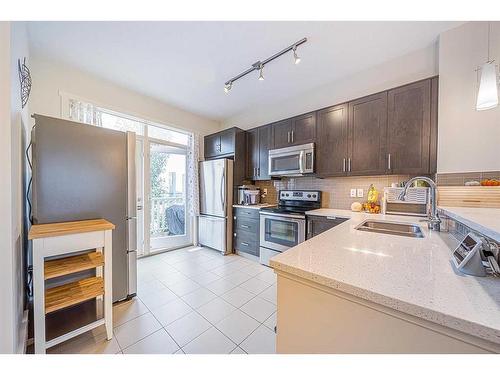 226 Nolanfield Villas Nw, Calgary, AB - Indoor Photo Showing Kitchen With Stainless Steel Kitchen With Double Sink