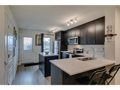 20581 Seton Way Se, Calgary, AB - Indoor Photo Showing Kitchen With Stainless Steel Kitchen With Double Sink